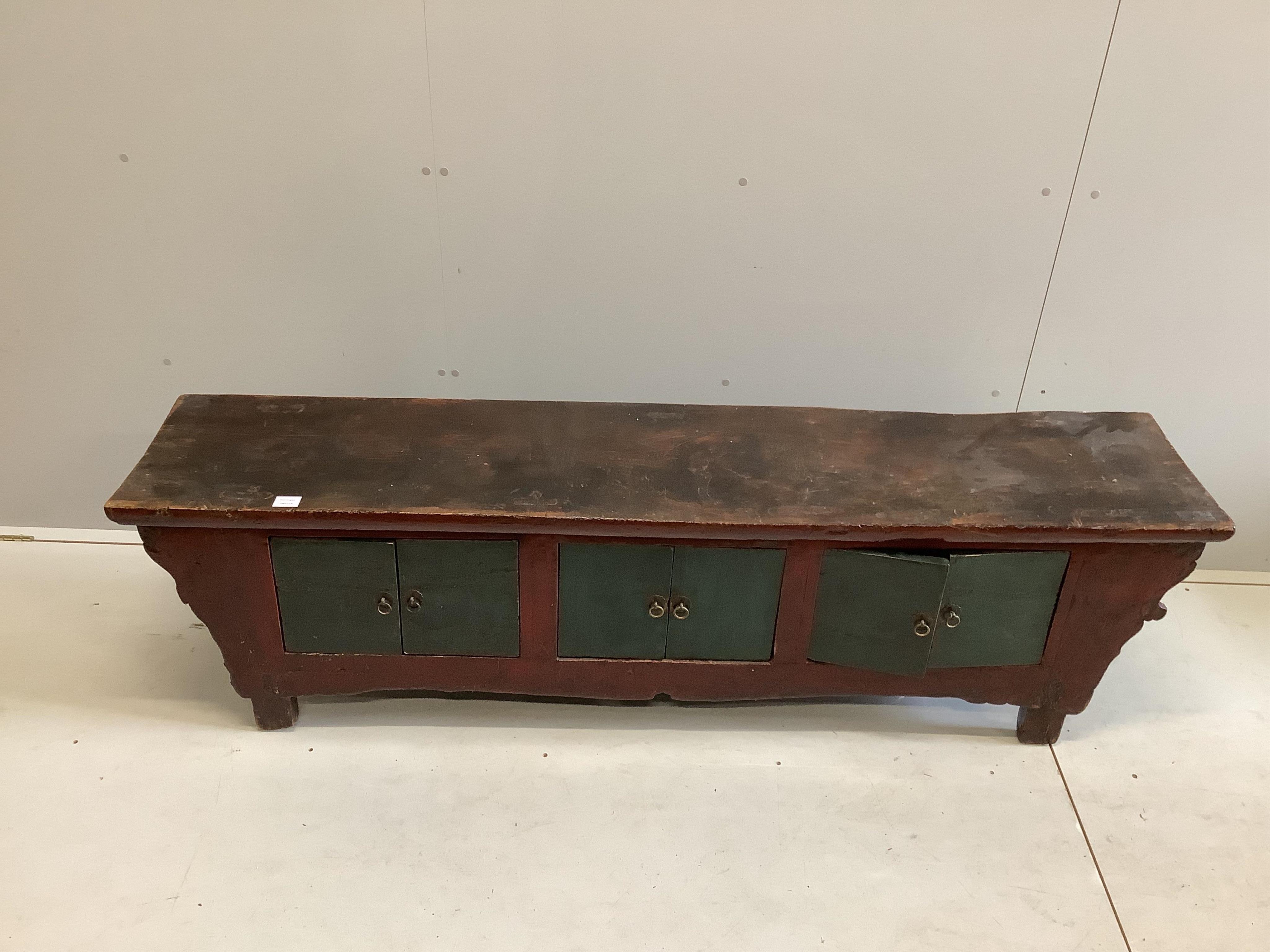 A Chinese painted low hardwood cabinet, width 185cm, depth 38cm, height 52cm. Condition - fair